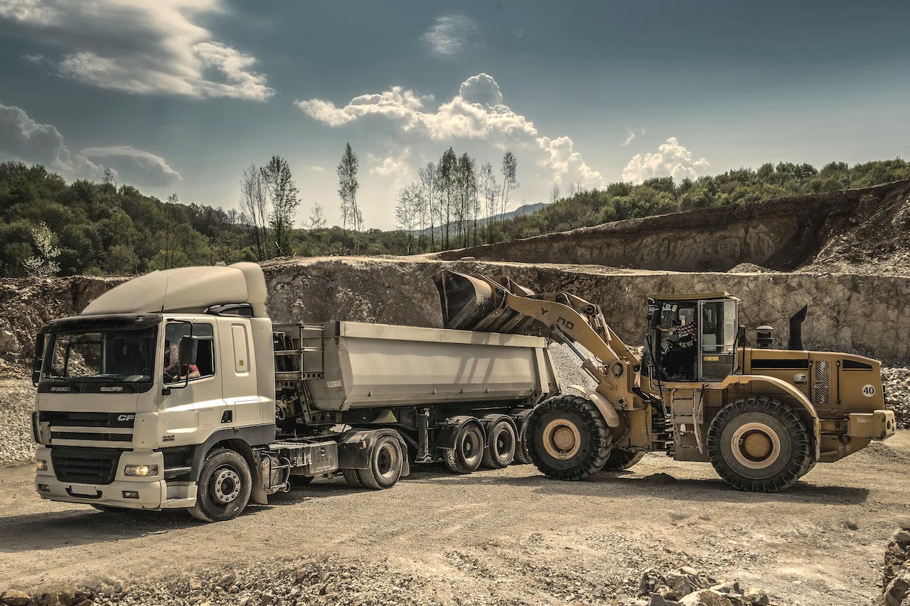 excavator loading dump truck - medium excavator loading dump truck - medium
